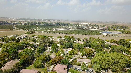 panorama of a region including Tell as Sawafir, which is just visible in the distance on the right