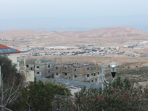 panorama of Araq ed Deir in the distance on the right