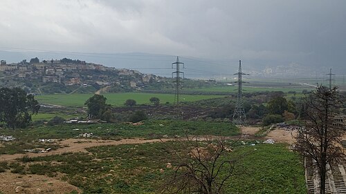 panorama including Khirbet Ibtin, which is at the base of the hill at center