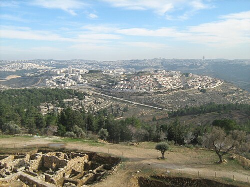cityscape looking south including Khirbet el Burj at the top of the hill at center