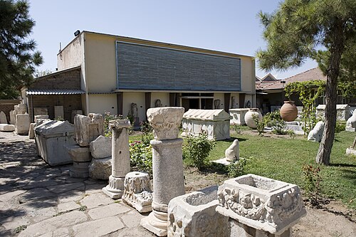 partially visible artifact from Tel Lystra, the leftmost of the three inscriptions under the awning